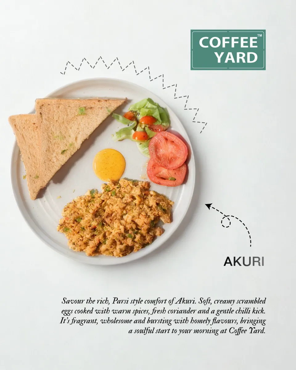 Akuri with toast and tomato, plated and labelled for a menu
