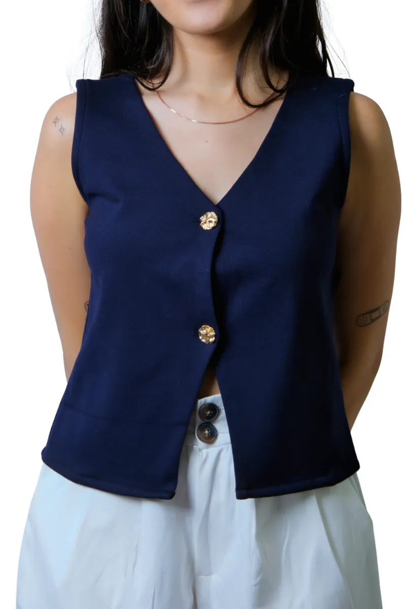 A navy buttoned waistcoat, photographed close