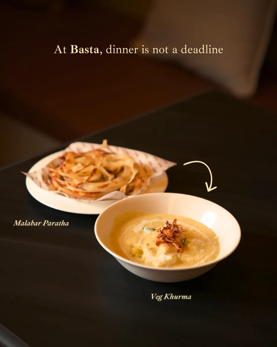 Malabar paratha with a bowl of curry, labelled for a menu